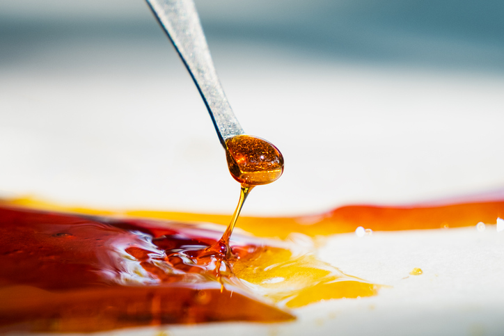 orange cannabis concentrate wax close up, high thc dab resin dab