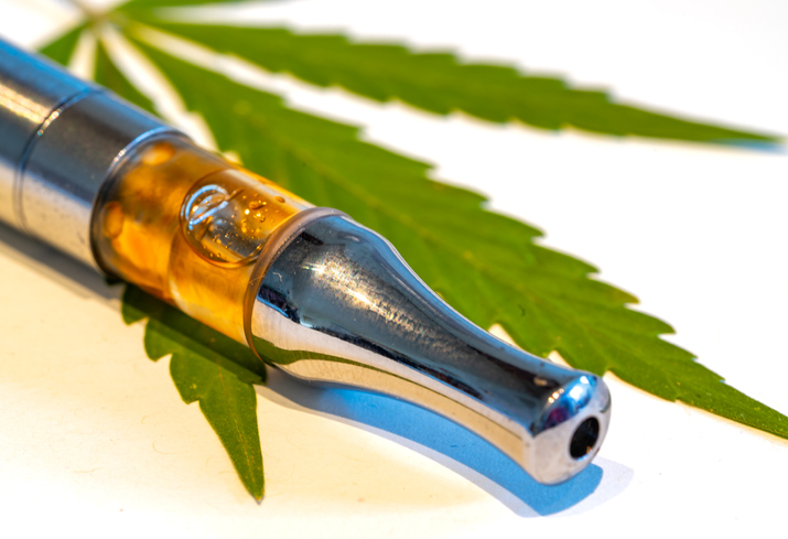 CBD vaporizer with a cannabis leaf isolated on white background canyouvapehashoil