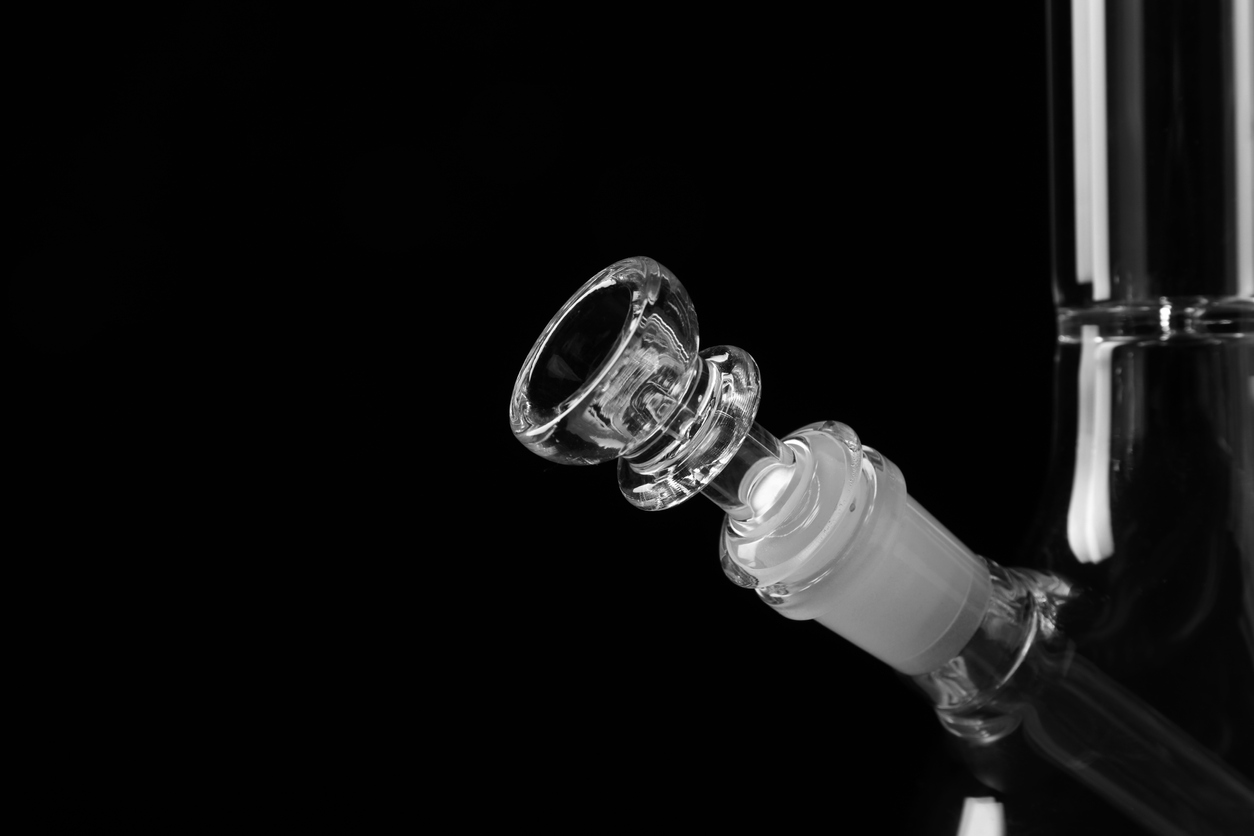 Closeup view of glass bong on black background, space for text. Smoking device